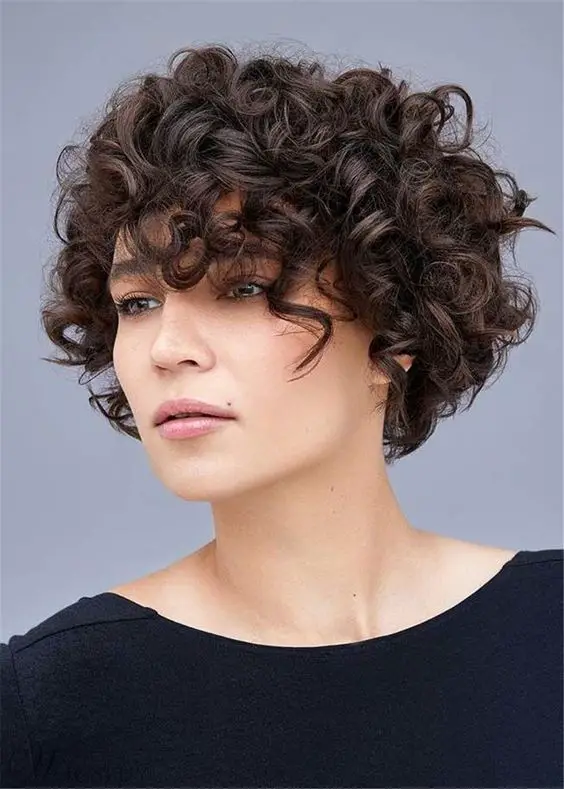 100 Stylish and Easy Short Hairstyle Ideas for Women to Try in 2022 Curly-pixie-with-side-bangs-3