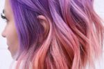 42. Pink And Purple Highlights Wavy Cut