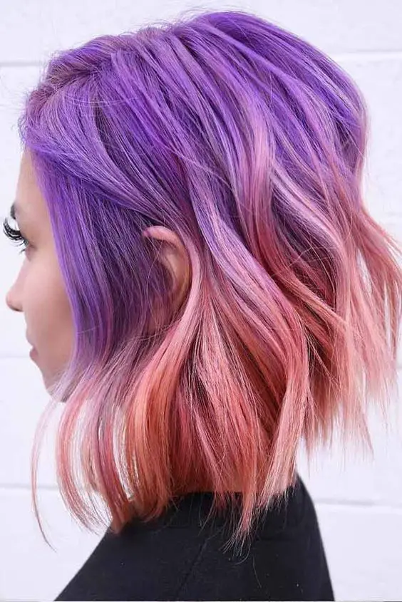 50 Hair Color Ideas for Women Over 40 (Updated 2022) 42.-Pink-and-purple-highlights-wavy-cut