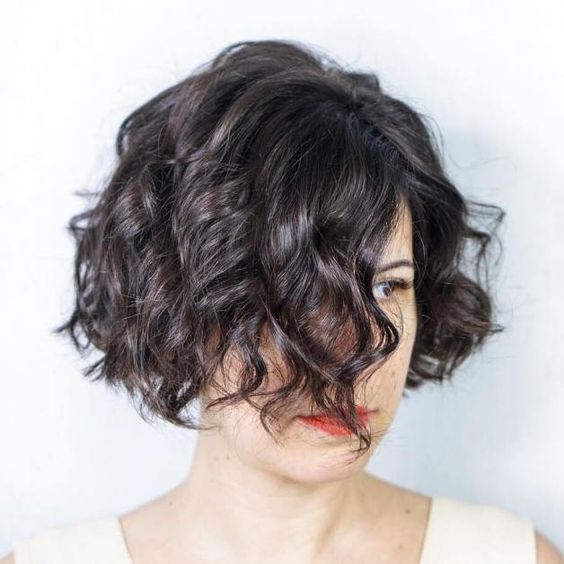 34 Cute Short Hairstyles for Women with Curly Hair (Must Try in 2022) Angled-curly-bob-1