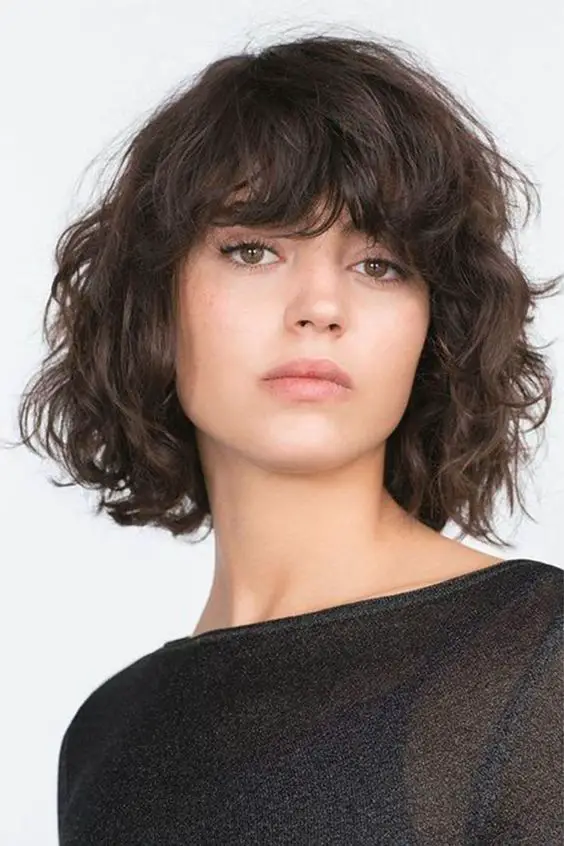 34 Cute Short Hairstyles for Women with Curly Hair (Must Try in 2022) Curly-blunt-cut-bob-2