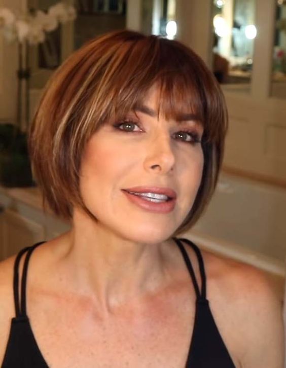 20 Chic Short Straight Hairstyles for Women Over 50 (Updated 2022) Rounded-bob-with-flat-bangs