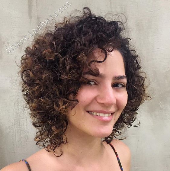 34 Cute Short Hairstyles for Women with Curly Hair (Must Try in 2022) Side-part-curly-weave-hairstyle-2