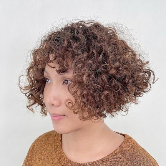 10 Very Short Curly Hairstyles for Women Over 50 (Updated 2022) Very-short-curly-blunt-bob-haircut