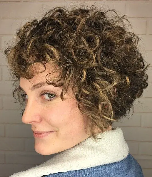 60 Best Short Curly Hairstyles for Women Over 60 in 2022 Shaggy-angled-curly-bob-4