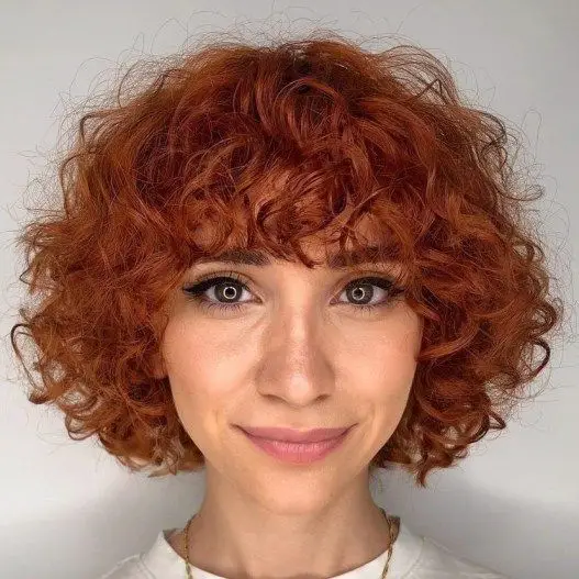 Very short curly bob with bangs