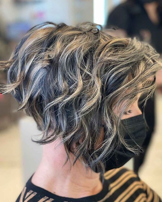 23 Excellent Short and Sassy Haircuts for Women Over 60 (Updated 2022) 20.-Stacked-curly-inverted-bob-hairstyle