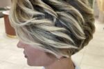 23. Voluminous Wedge Haircut With Blonde Highlights