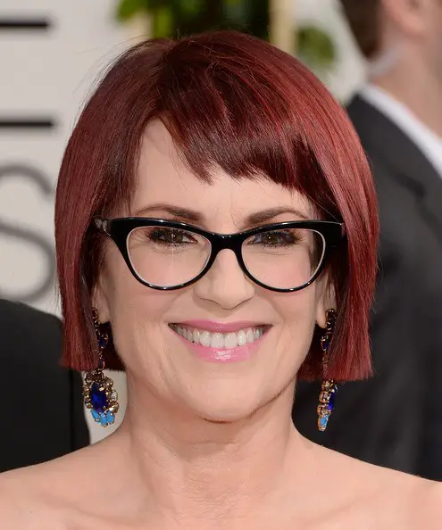 classy short bob hairstyle for older women with glasses