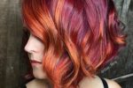 Messy Pastel Curly Short Bob Hairstyle With Fire Color