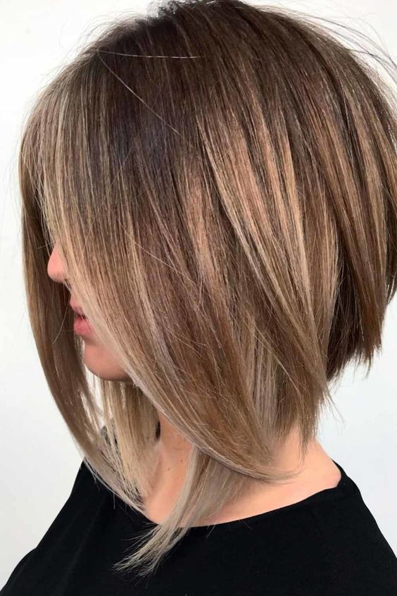 20 Appealing Short Edgy Haircuts for Women that on Trends Right Now Shoulder-length-angled-bob-with-feathers