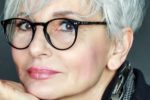 21 Short Hairstyles for Women with Grey Hair and Glasses (Updated 2022) short-flat-haircut-with-bangs-for-over-60-women-with-grey-hair-150x100