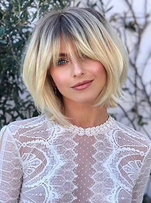 60 Excellent Short Hairstyles for Round Faces to Look Stunning Angled-shaggy-bob-with-fringe