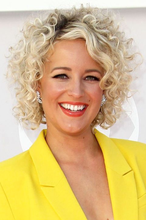 64 Stunning Short Curly Hairstyles for Women over 50 that Worth to Try beautiful-curly-hairstyle-with-side-swept-bangs