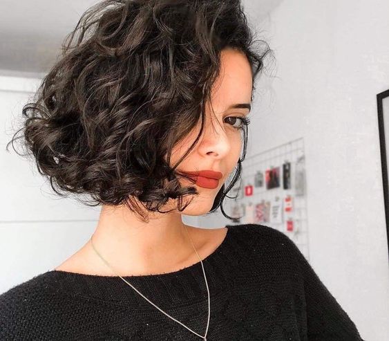 Short Voluminous Curly Hairstyle with Deep Side Part - 8 Best Short ...