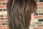 Neck Length Shaggy Hairstyle With Blunt Bangs
