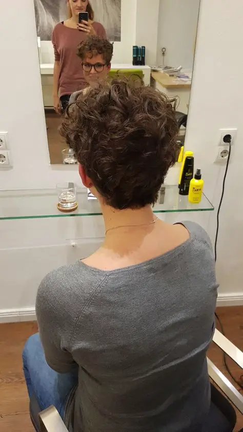 very short natural curly wedge haircut